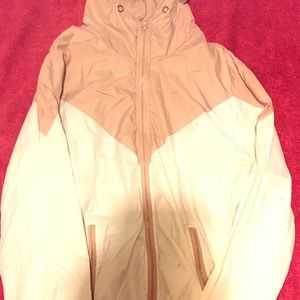 Pink and white windbreaker.